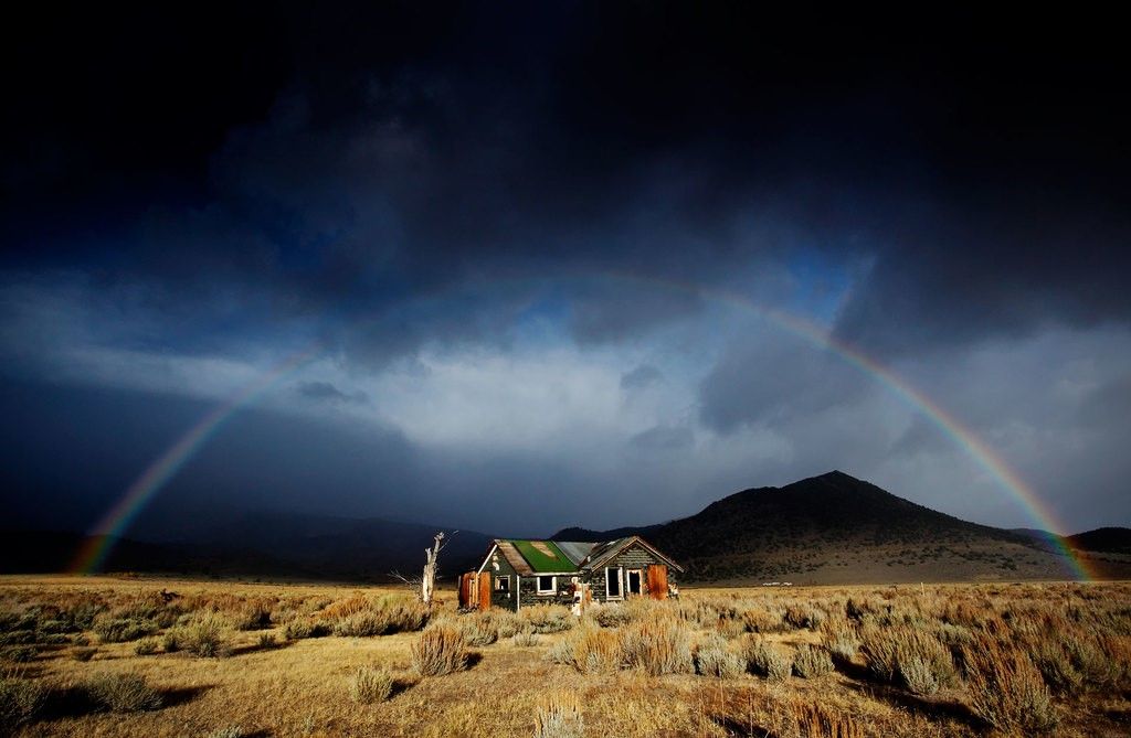 House with mountain behind and rainbow overhead - marriage - Divorce Done Differently in PA