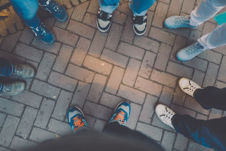 feet in tennis shoes facing each other on walkway| collaborative divorce process| Divorce Mediation Checklist | Divorce Done Differently PA