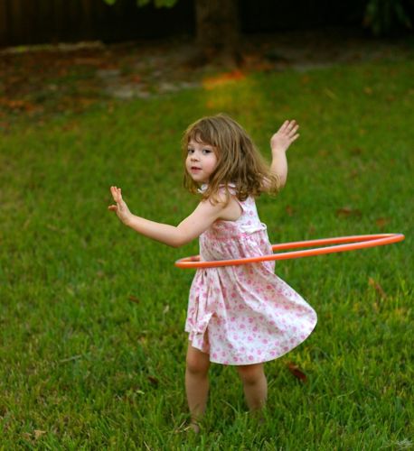 Brown haired girl playing with hula hoop | Co-Parenting Amid COVID | Divorce Done Differently in PA