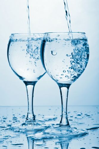 Two wine glasses being filled with pure water | Peace in the Divorce Process and the power of the words "Would you consider?" | Divorce Done Differently in PA