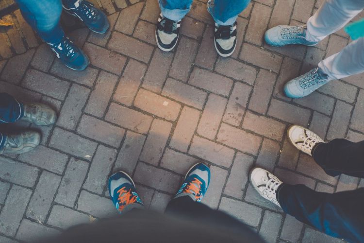 feet in tennis shoes facing each other on walkway| collaborative divorce process| Divorce Mediation Checklist | Divorce Done Differently PA