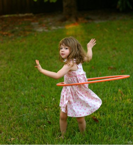 Brown haired girl playing with hula hoop | Co-Parenting Amid COVID | Divorce Done Differently in PA